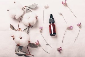 Abstract cosmetic laboratory. Bottles of dark amber glass on a white background organic flax. Natura